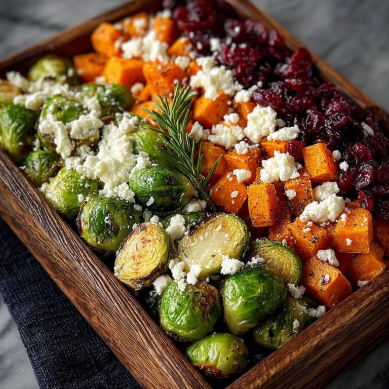 Cranberry-Glazed Roasted Butternut Squash, Brussels Sprouts, and Sweet Potato Salad with Goat Cheese Recipe